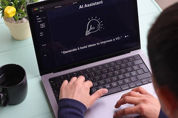 Person using AI Assistant laptop
